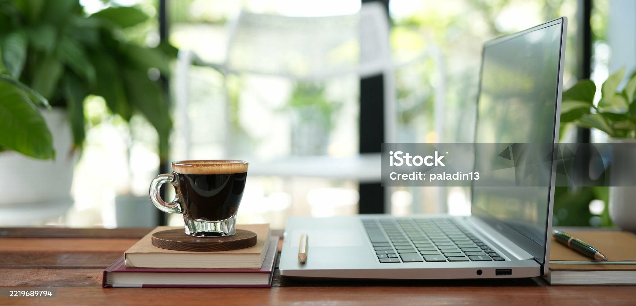Coffee break and laptop on rustic wood table